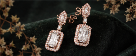 Editorial styling image of a pair of drop earrings