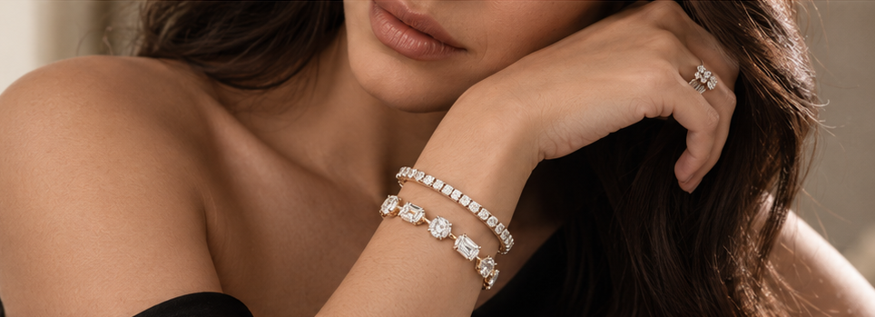 Warm editorial portrait with round and mixed-shape diamond bracelets; styling visual