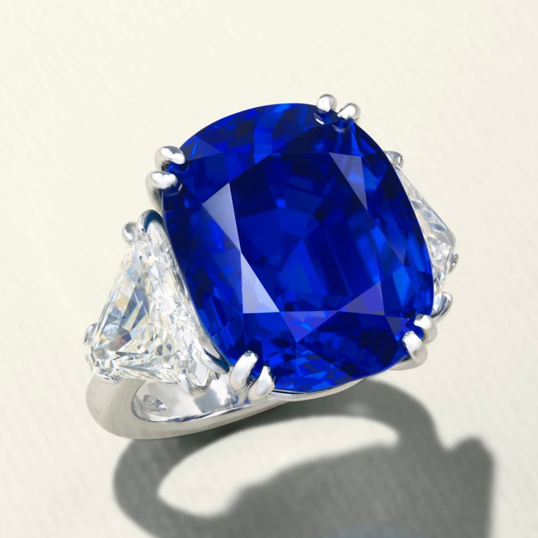 Blue gemstone ring photographed on a pale background